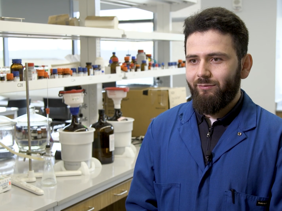 male student in chemistry lab