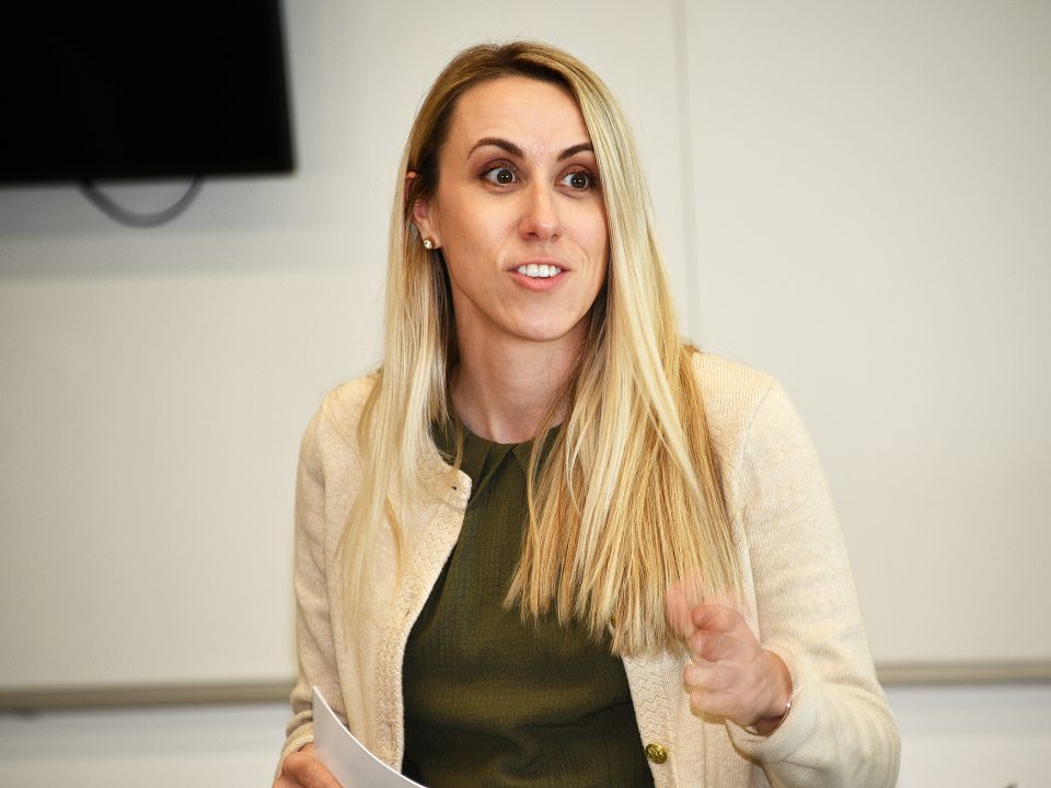 Headshot of student Veronica Farrell speaking in front of a classroom.