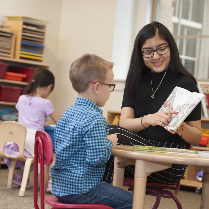 female student teacher working one on one with a student