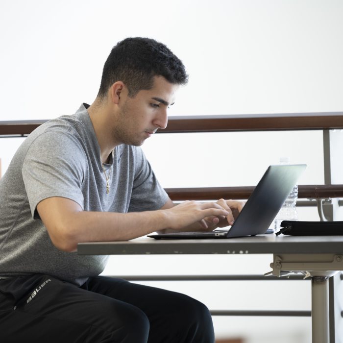male student on laptop