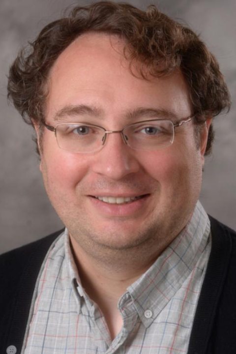headshot of Theo Rhodes