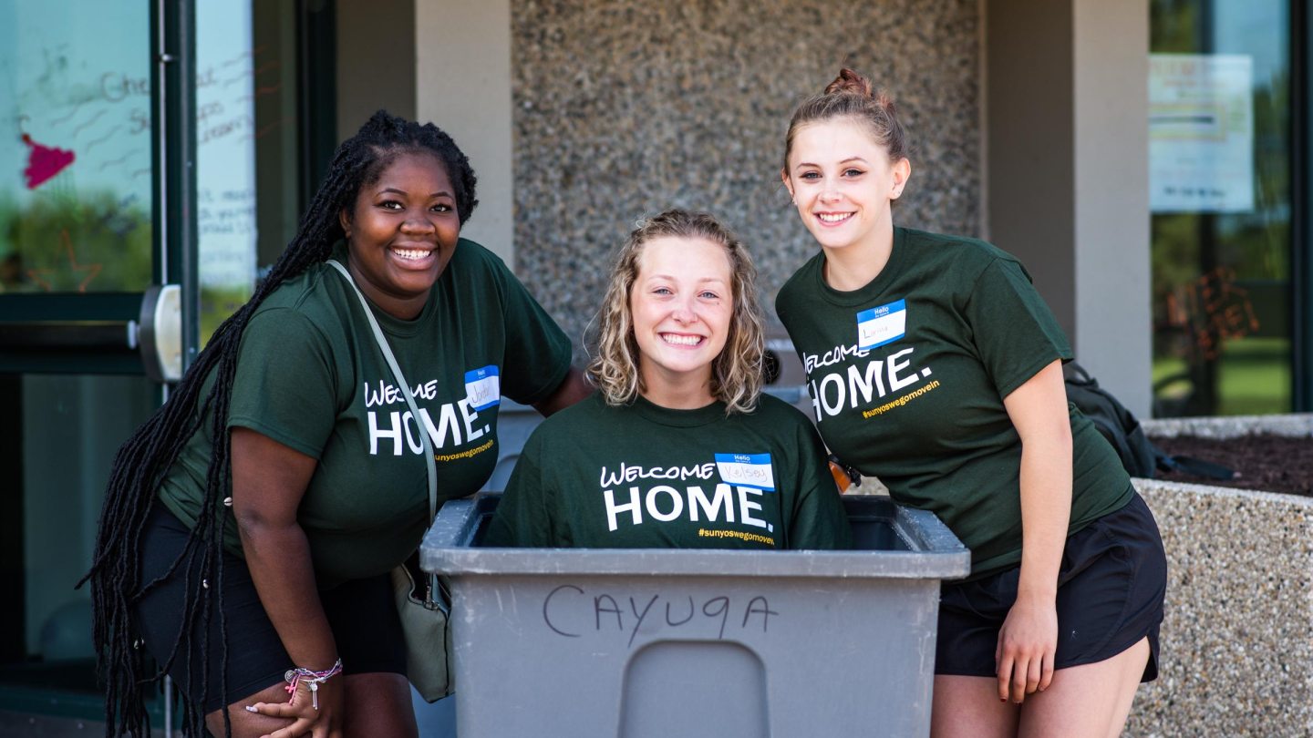 Three move-in crew members pose for the camera