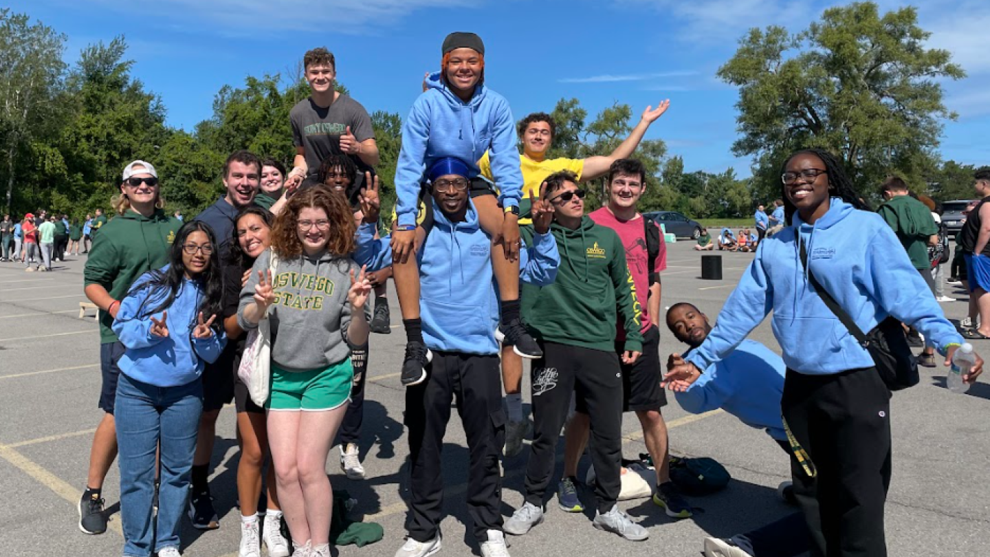 Students celebrating and posing for a photograph. 