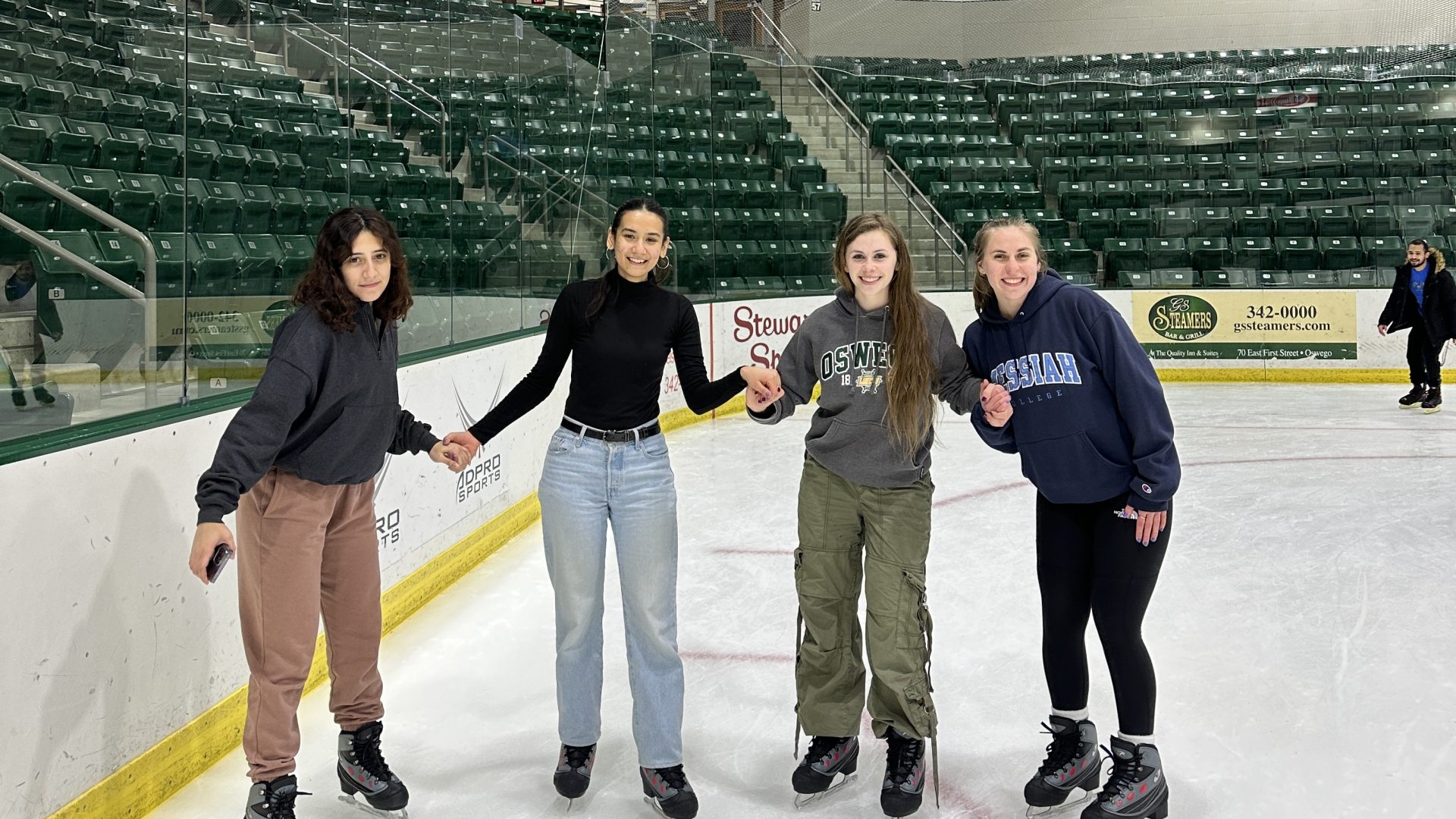 Four students ice skating. 
