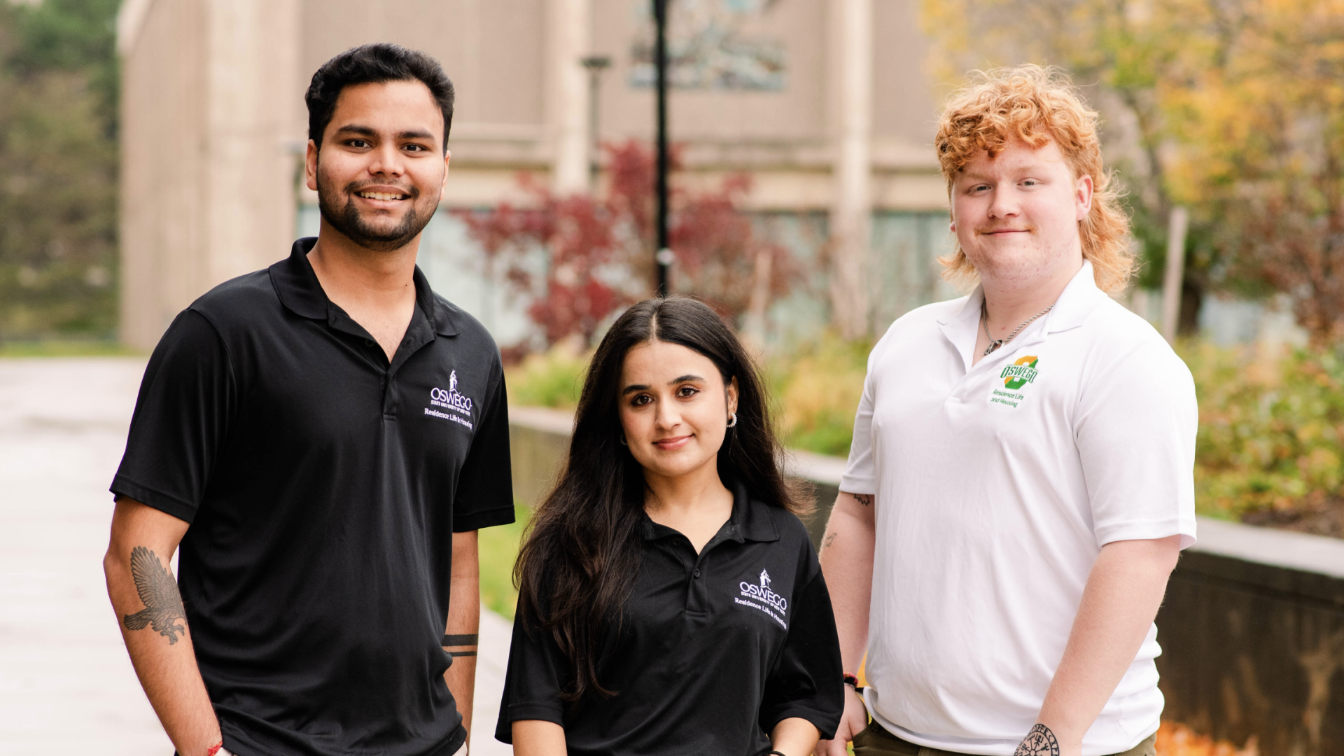 Three RA's wearing their polos. 
