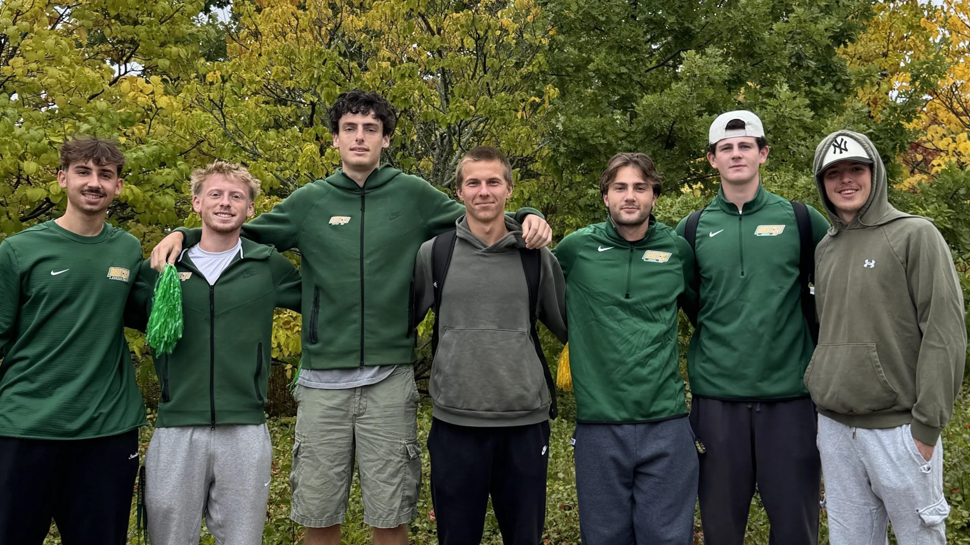 Seven students wearing Oswego merch 