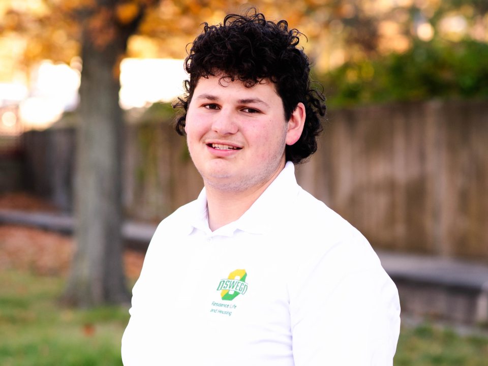 Student wearing a white RA polo.