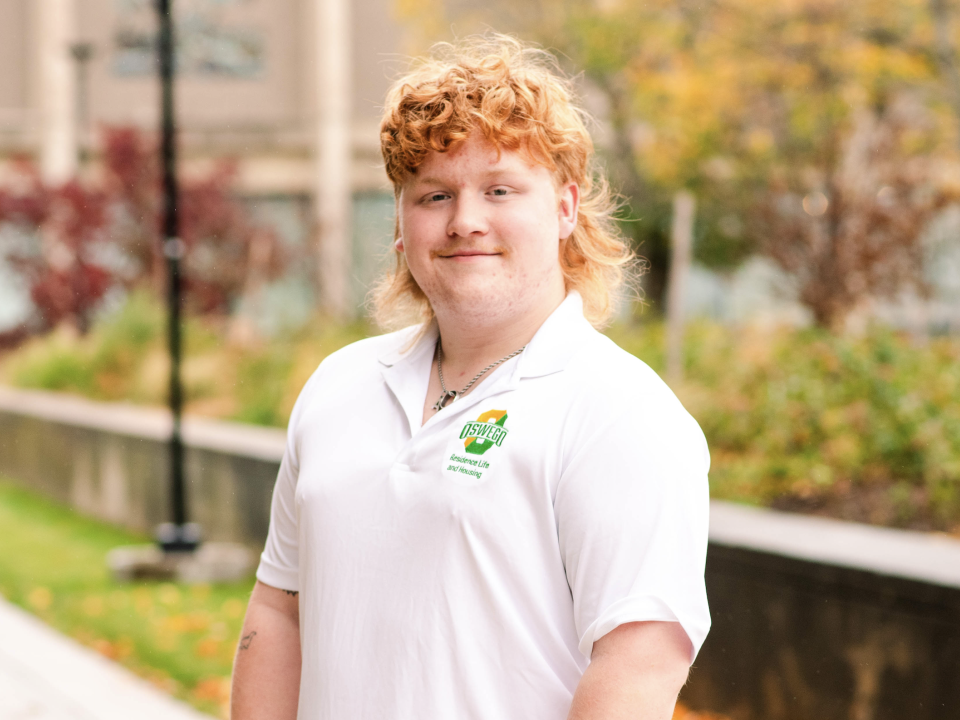 Student wearing a res life polo. 