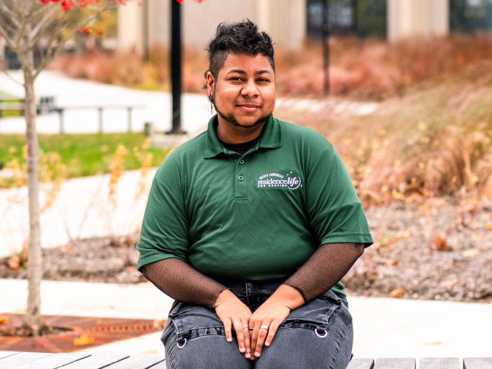 Student sitting on a bench. 