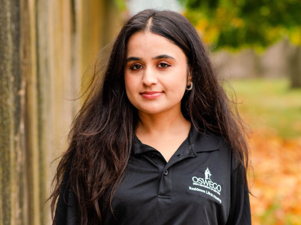 Student wearing a res life polo. 