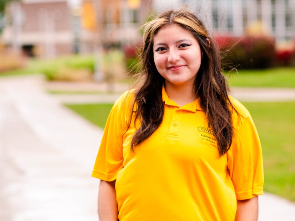 RA wearing a polo smiling at the camera.