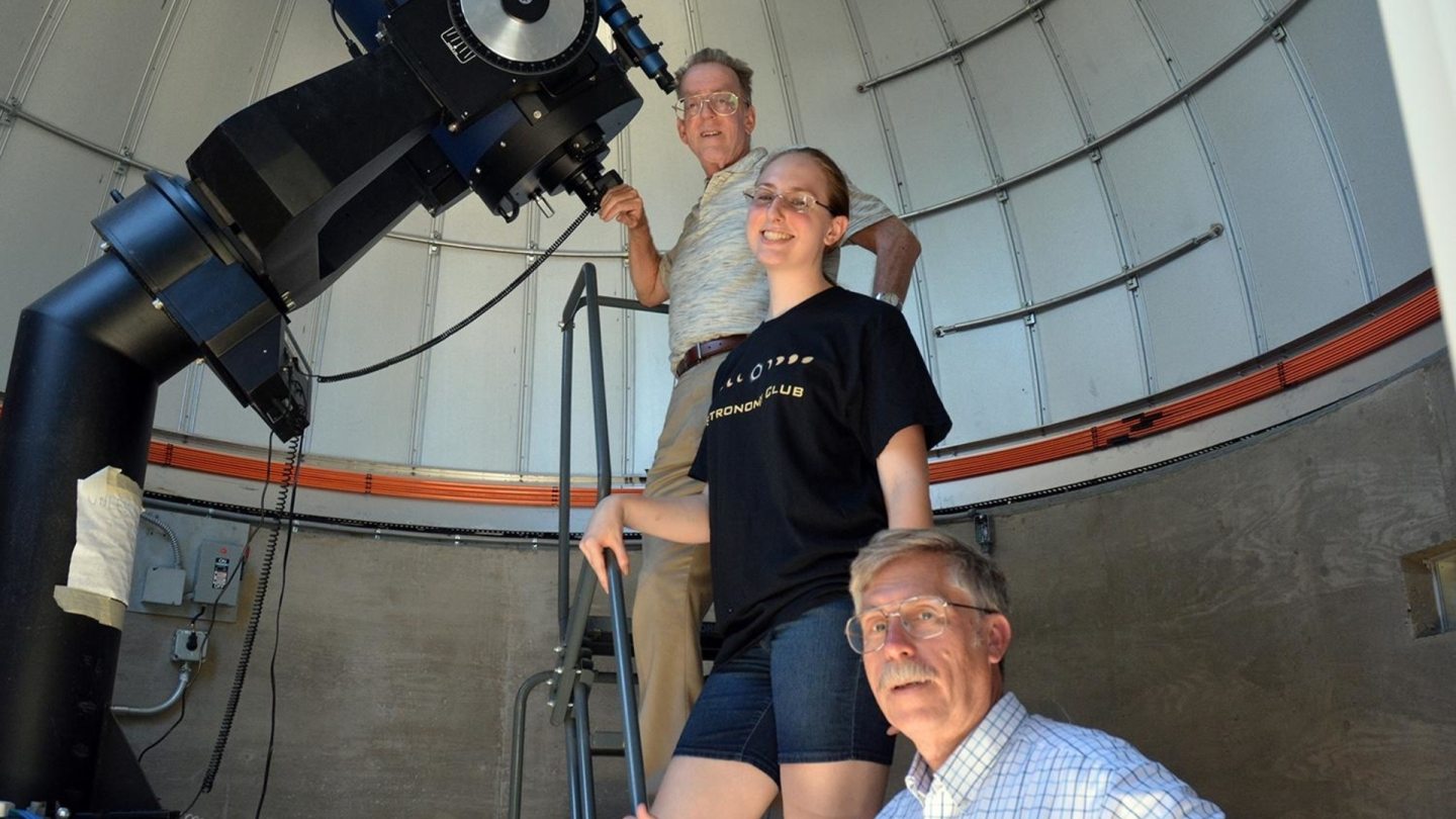 SUNY Oswego faculty and student inside the astronomical observatory at Rice Creek Field Station