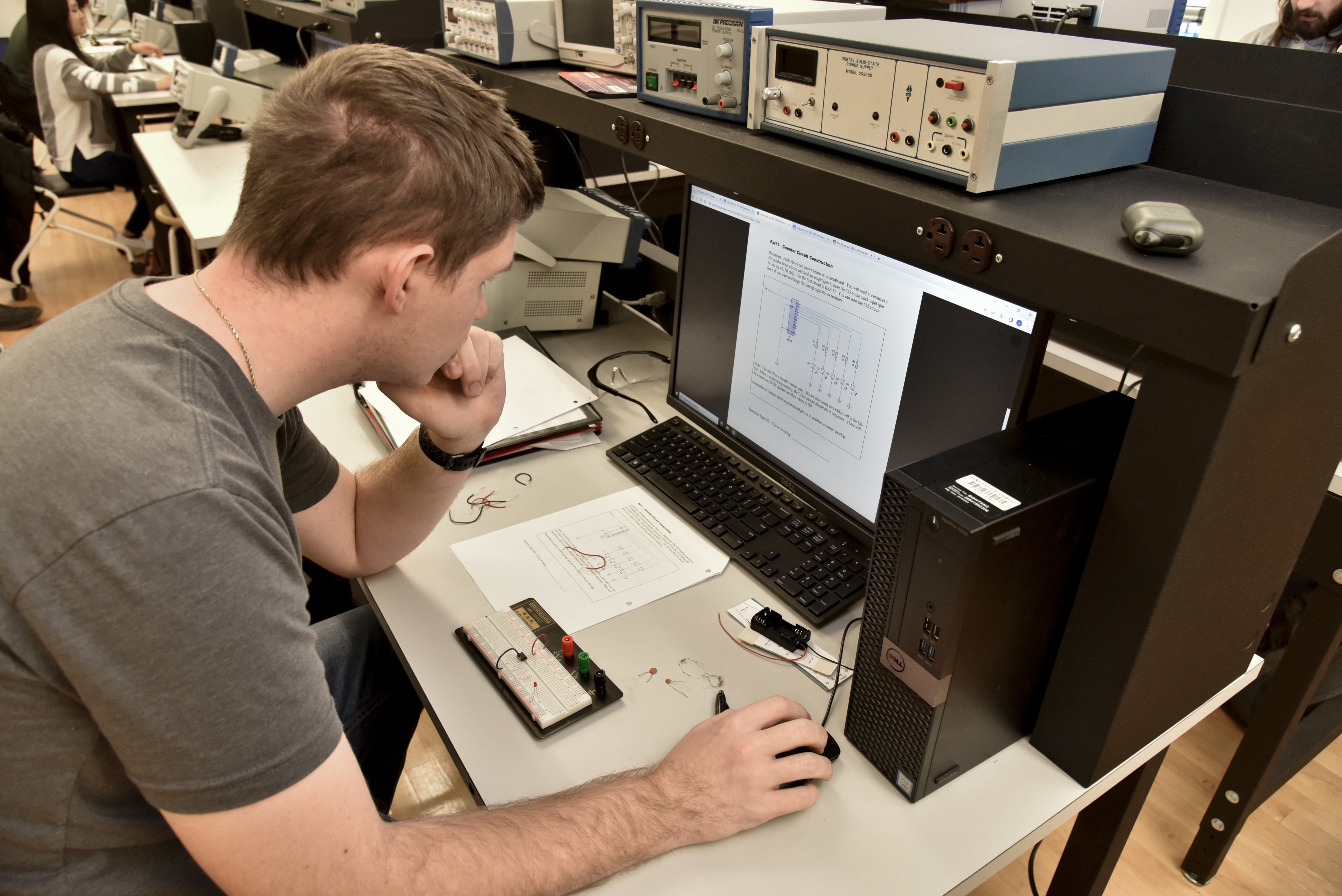 male student working on a computer