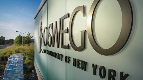 Oswego’s main entrance sign reading Oswego State University of New York