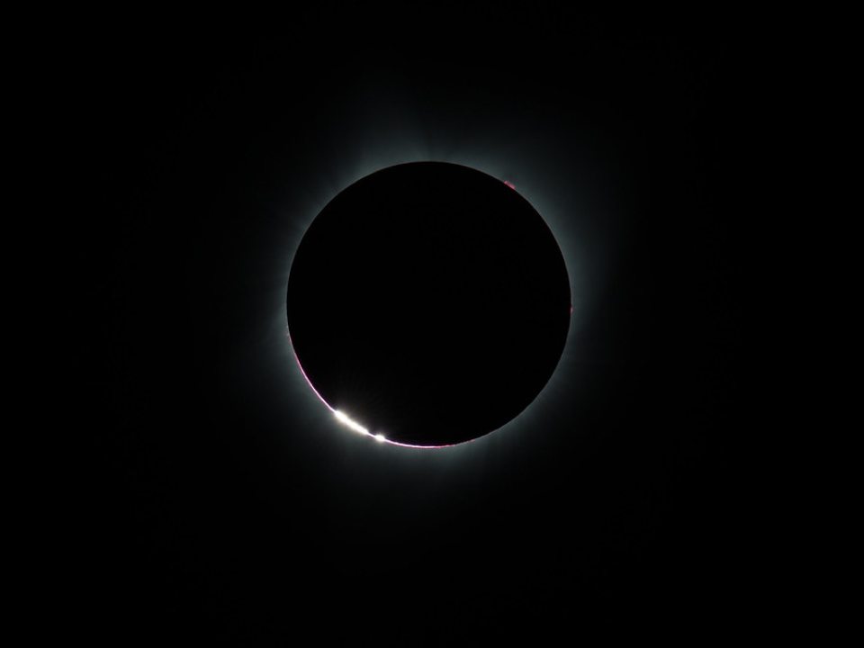 Baily’s Beads effect, as the Moon makes its final move over the Sun during a total solar eclipse