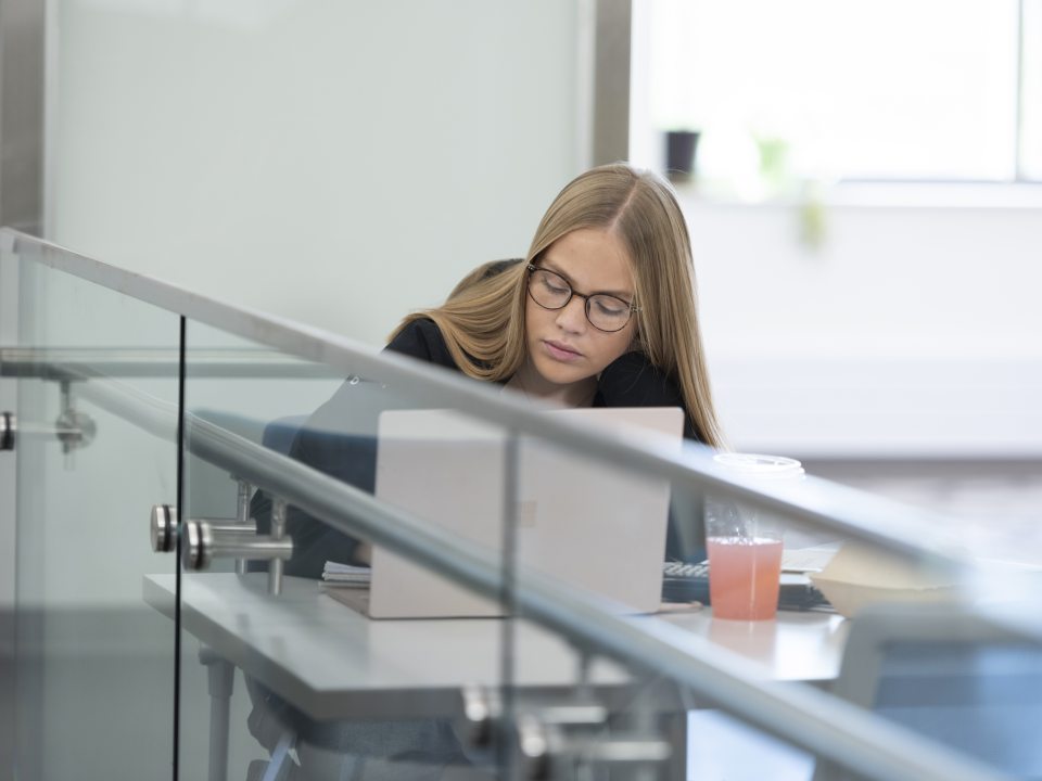 female student working on a laptop