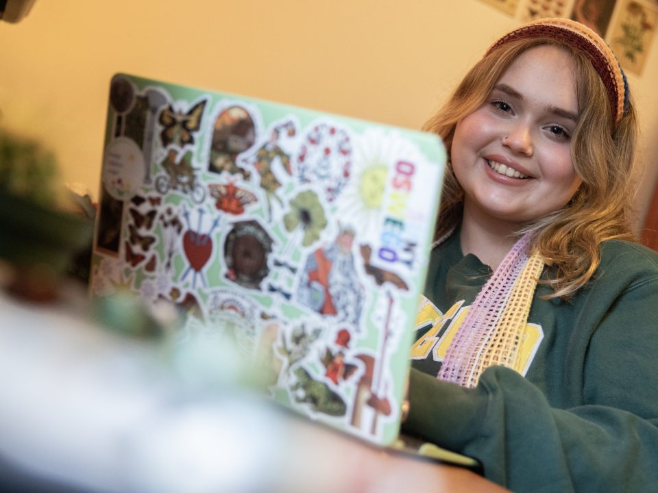 female student sitting at a laptop