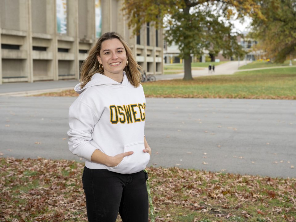 female student standing in the quad