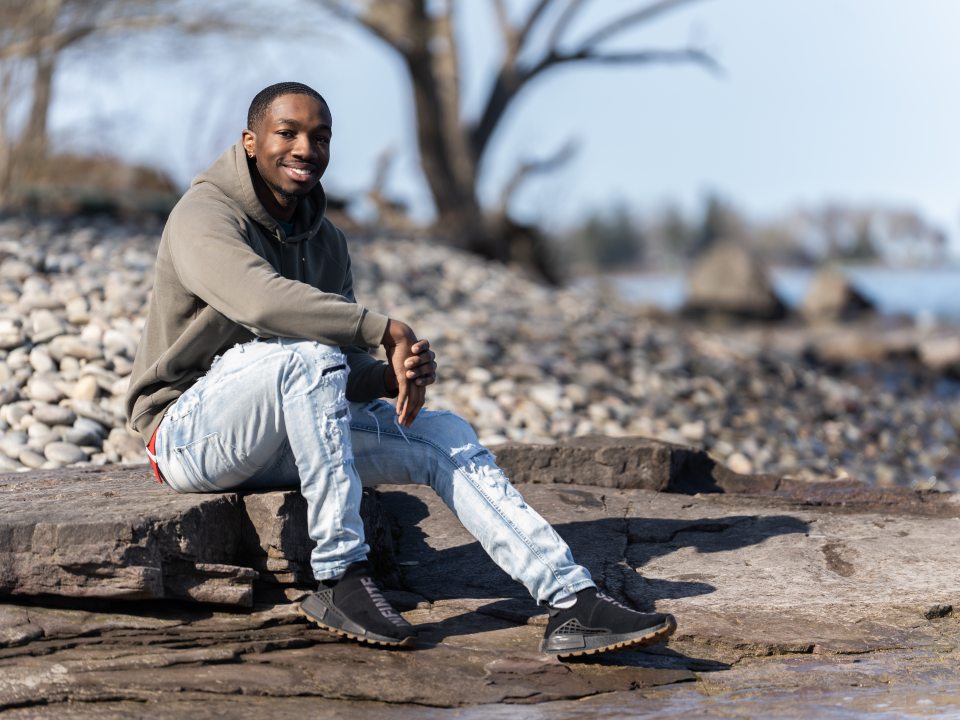 headshot of student sitting at the lake