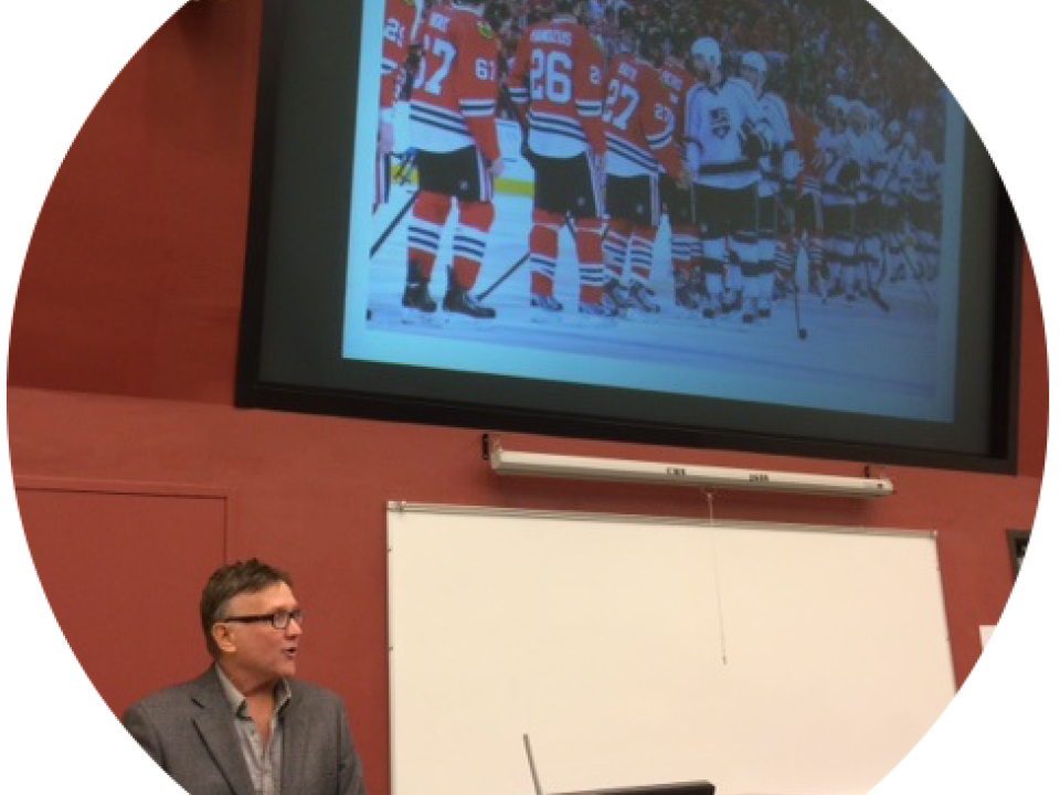 Speaker giving a presentation during Sportsmanship Day Symposium