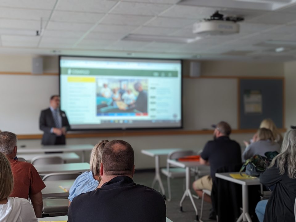 Justin Dickerson, Director of SOFE, presents to family supporters during Summer Orientation.