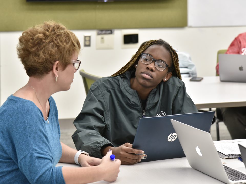 professor talking to student