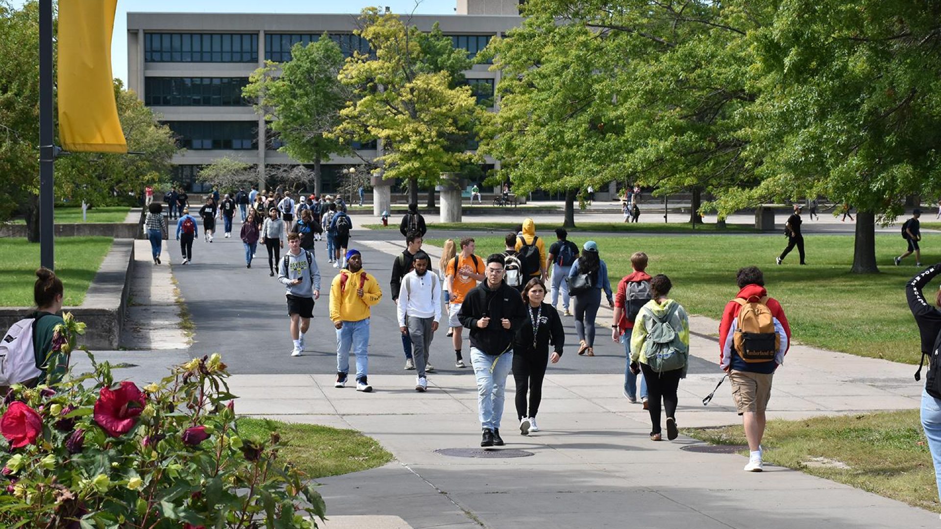 Students walking through SUNY Oswego campus