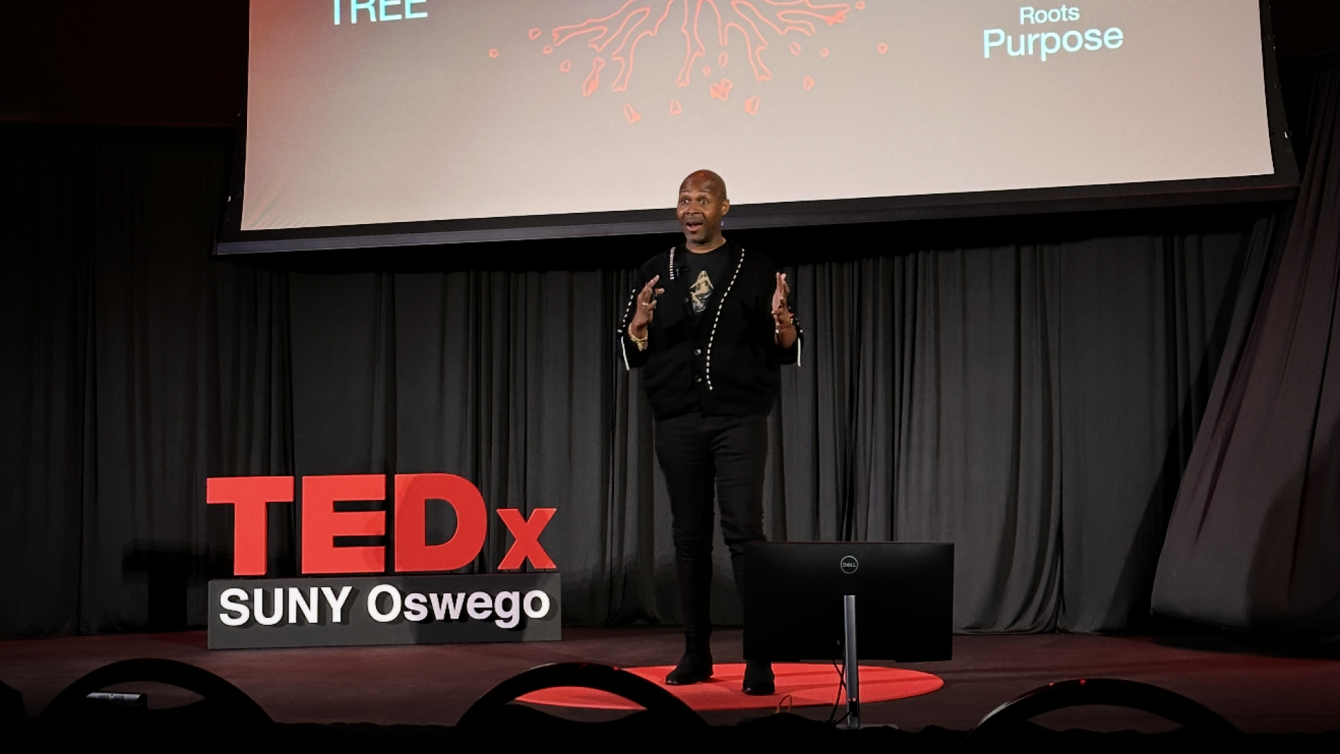 Aunrée J L Houston on the TEDx SUNY Oswego stage
