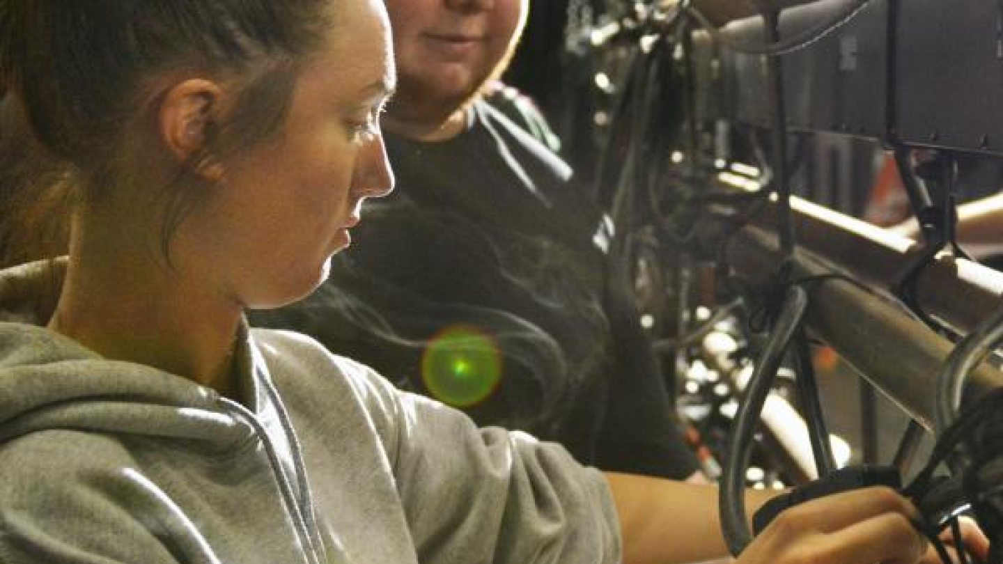 A student working with production equipment