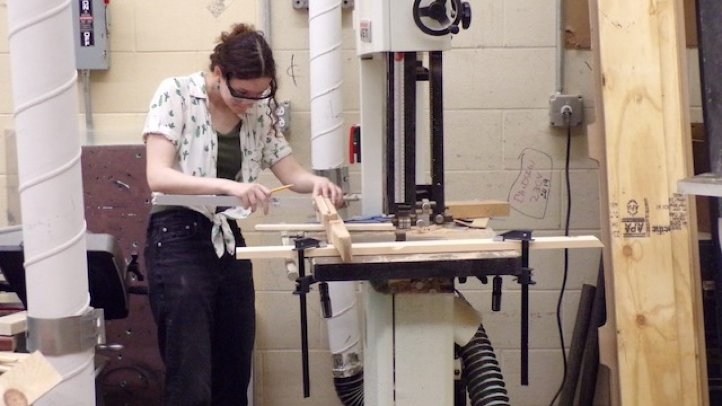 Student using a bandsaw