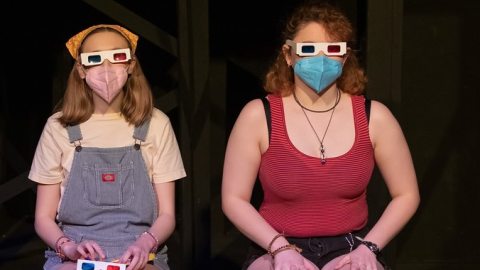 Two female presenting students facing front with 3D glasses on