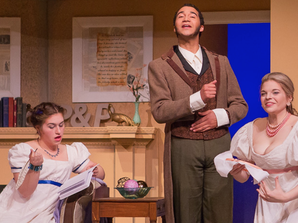 Three actors (woman on the left, man in the middle, and woman on the right) acting out a scene