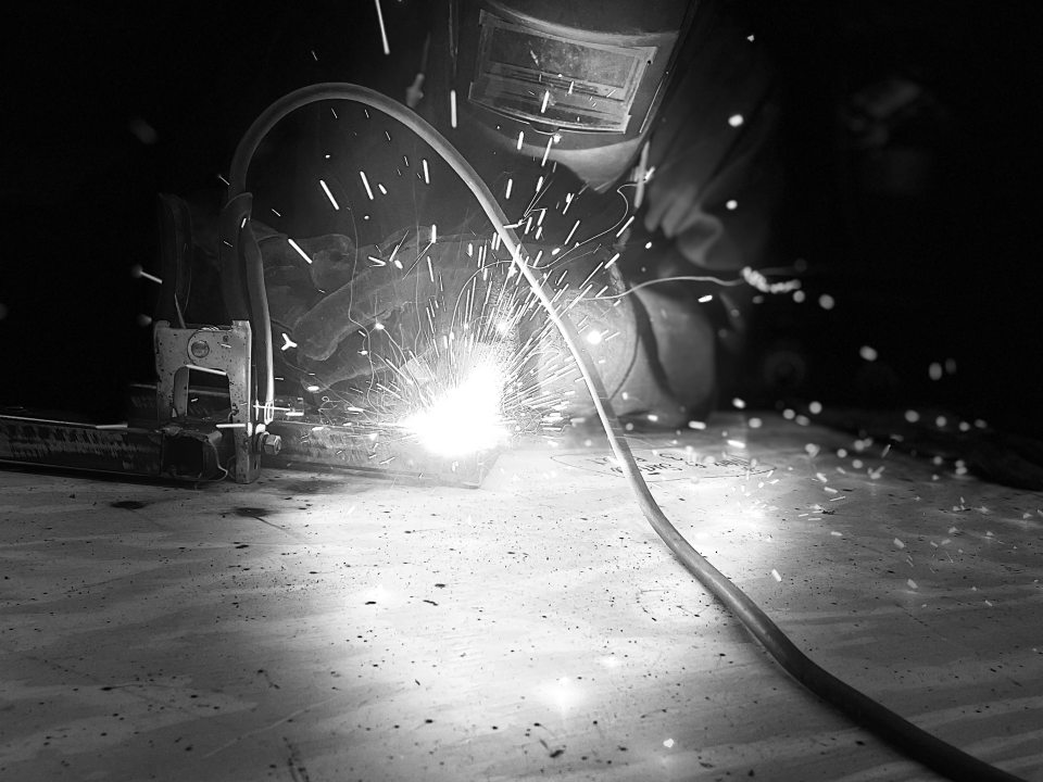 a black and white image of a metal wielder working