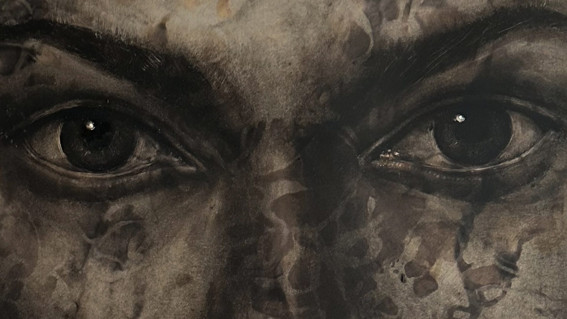 greyscale drawing of a face with dark blotches 