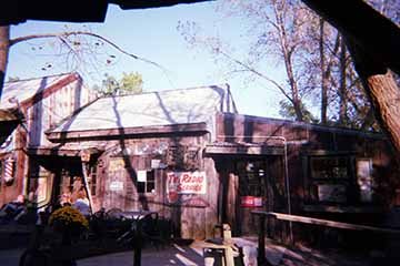A photograph of an old winery house in the daylight.