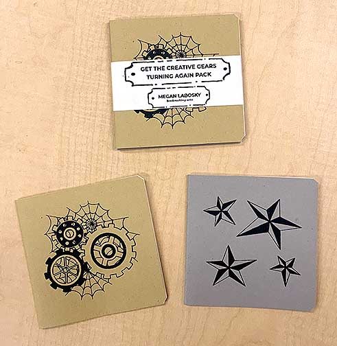 A series of screen printed, hand made field note books with a cover.