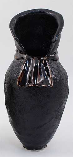 Textured black vase sculpture.