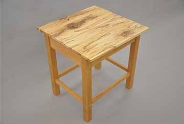 An end table 20 inches with cherry wood legs and support, the tabletop surface is made of Spalted Maple. A type of maple harvested just after decay begins resulting in an intricate pattern of fungal activity within the wood.