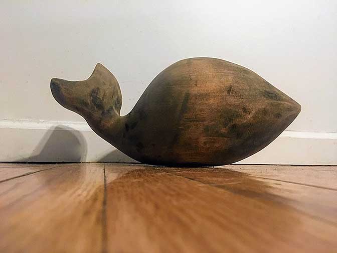 WhatAWhale is a sculpture that was created as a commission piece for my lovely grandmother, it is a small, dark stained whale that has a tail that is in motion. 