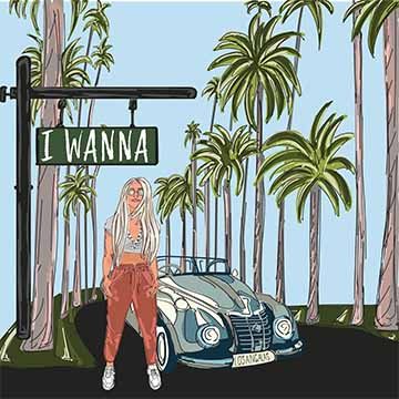 road in LA. She has blond hair and is next to a blue old fashioned car. There is a road sign above her that says “I Wanna” which is the name of the song.  She's surrounded by palm trees that continue down both sides of the road. In the background there is a blue sky and a long black road.