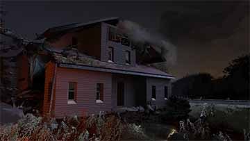 A dark night scene shows a broken down red house. Smoke billows from the right side. There is a bright orange light from the left of the frame illuminating the left side of the house. Rubble and other debris covers the ground.