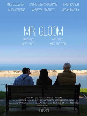 Two teenagers and an old man sit on a bench overlooking a large body of water. There is a faint red sunset emerging from the horizon. The title “Mr.Gloom” is clearly seen in the top center of the frame. The rest of the image contains text including the names of the actors and proper credits at the bottom of the image. 