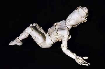 This ninety piece ceramic set consists of one figurative sculpture and various shaped and scaled vessels. The body of work begins with an all white semi nude female figure laying on the ground with her eyes closed and one hand reaching out. Over her body grows floral-like petals and moves in one general direction towards the extended hand. In her hand is one pure white flower. From her hand the vessels start to emerge and grow away from her and in an upwards direction. As we move away from the vessels close