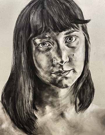 This is a charcoal self portrait. 
